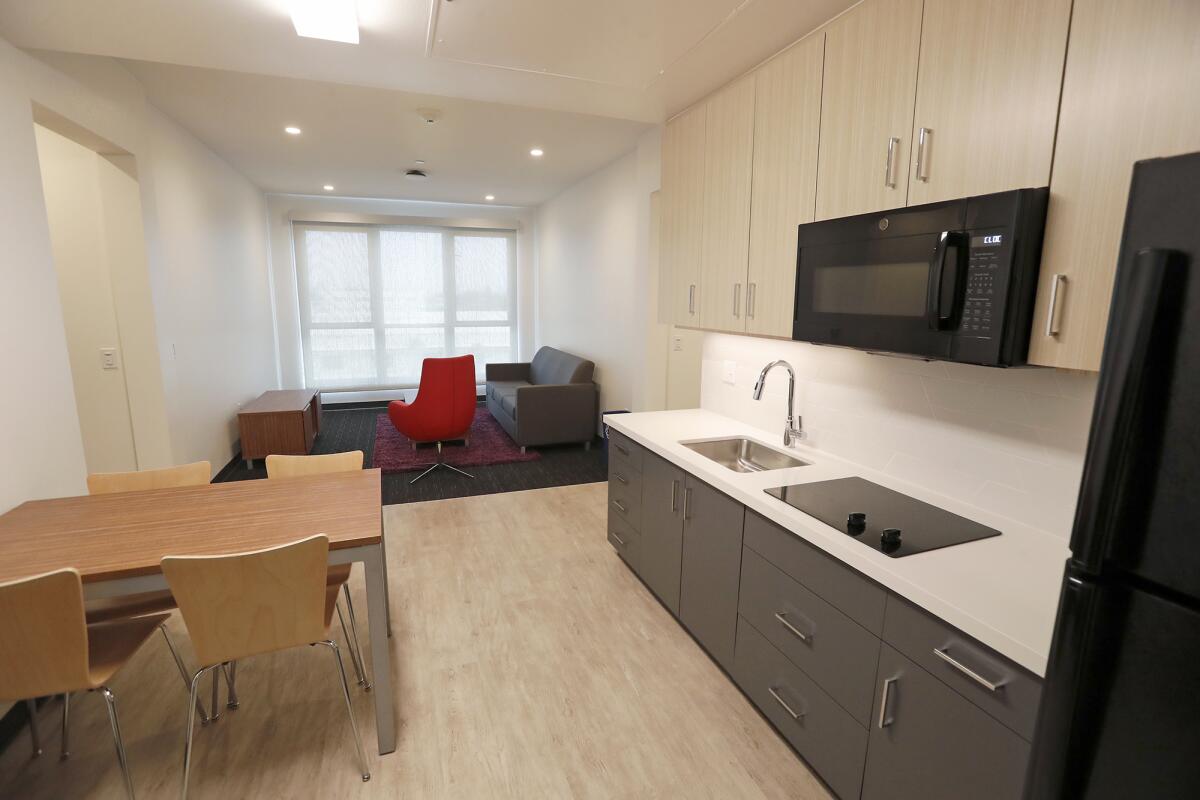 The dormitory of the K sleeps four students in a two-bedroom suite, with a kitchenette that includes an electric stove, built-in microwave, and full-size refrigerator.