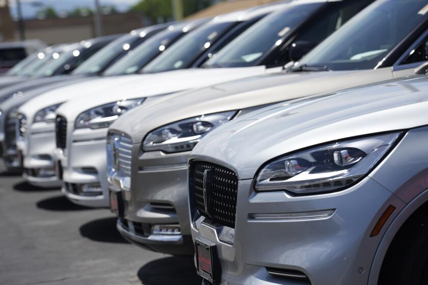 File - Unsold 2023 Aviator sports-utility vehicles sit in a long row at a Lincoln dealership on June 18, 2023, in Englewood, Colo. The strike against Detroit's three automakers didn't make much of a dent in auto sales last month. (AP Photo/David Zalubowski, File)
