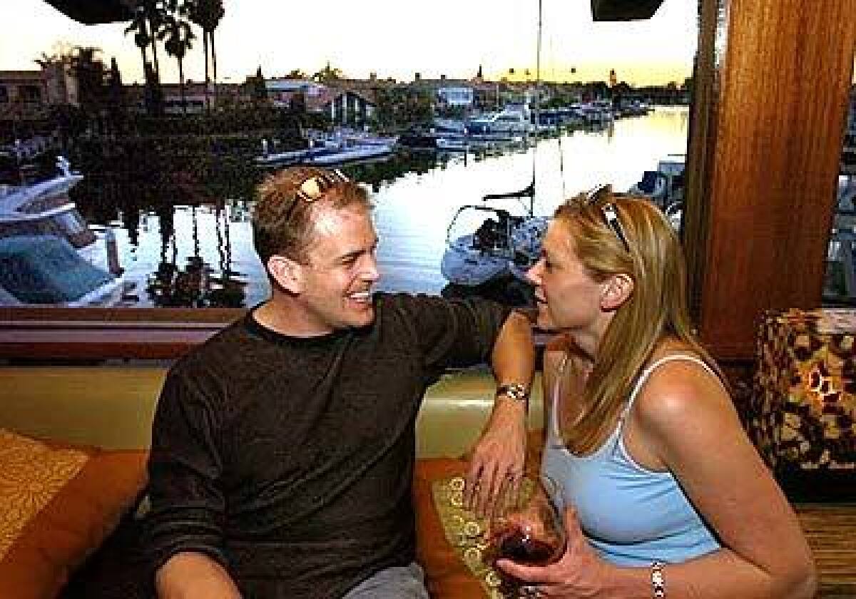 Reid Cerne and Meredith Kline chat in the newly opened 3-Thirty-3 restaurant in Newport Beach, a popular spot for singles.