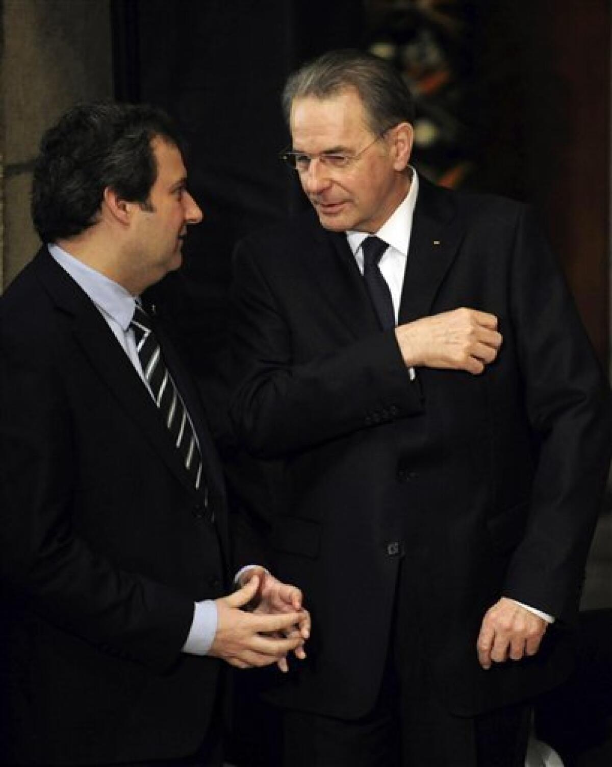 Jacques Rogge, right, President of the International Olympic Committee (IOC), talks with Jordi Hereu, Barcelona's major, during the farewell ceremony for the International Olympic Committee president Juan Antonio Samaranch at the Palau of Generalitat in Barcelona, Spain, on Thursday, April 22, 2010. Former International Olympic Committee president Juan Antonio Samaranch died Wednesday at age 89 in the Quiron Hospital in his home city of Barcelona of cardio-respiratory failure three days after being admitted with heart problems. (AP Photo/David Ramos)