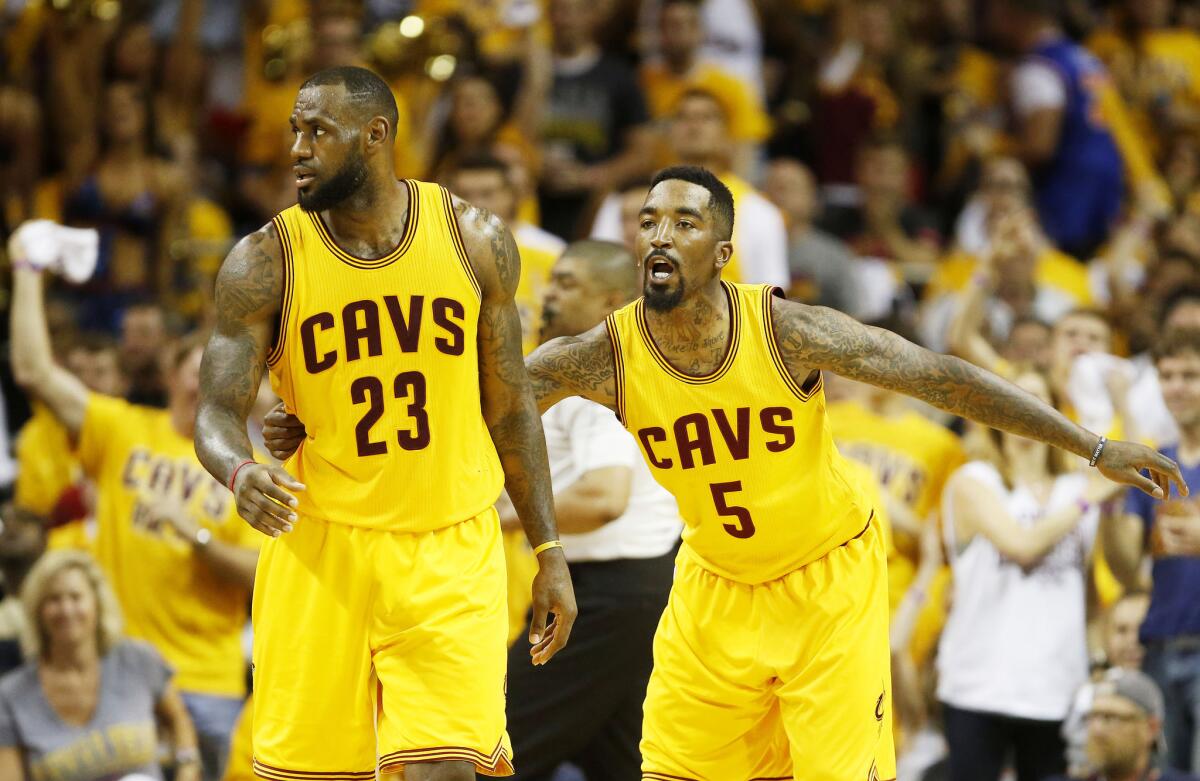 LeBron James and J.R. Smith react during the fourth quarter of an Eastern Conference finals game vs. Atlanta Hawks.