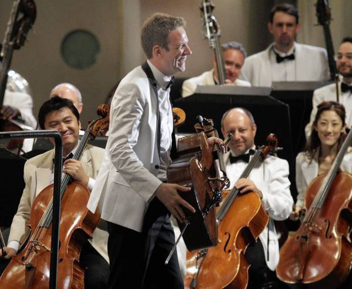 German cellist Johannes Moser acknowledgies the audience's applause with the L.A. Phil at the Hollywood Bowl.