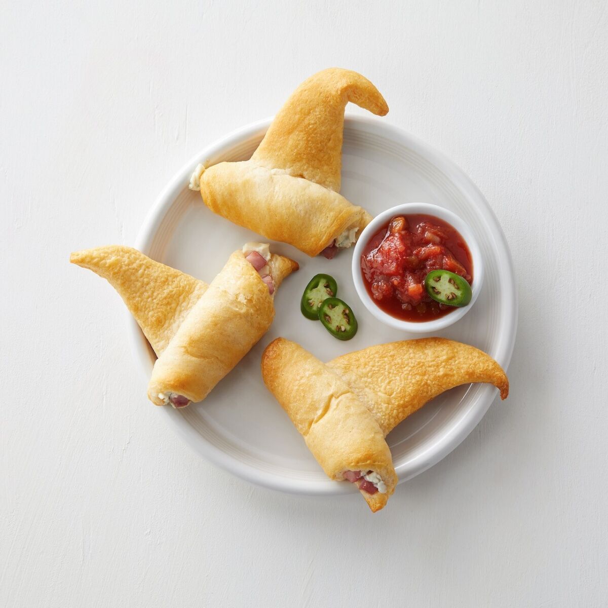 Witch "hats" made of crescent rolls, ham and cream cheese.
