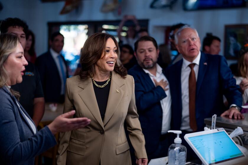 PHOENIX, ARIZONA - AUGUST 9: Democratic presidential candidate, U.S. Vice President Kamala Harris, Rep. Ruben Gallego (D-AZ) (2nd-R) and Democratic vice presidential candidate Minnesota Gov. Tim Walz (R) order food at Cocina Adamex restaurant on August 9, 2024 in Phoenix, Arizona. Kamala Harris and her newly selected running mate Tim Walz are campaigning across the country this week.(Photo by Andrew Harnik/Getty Images)