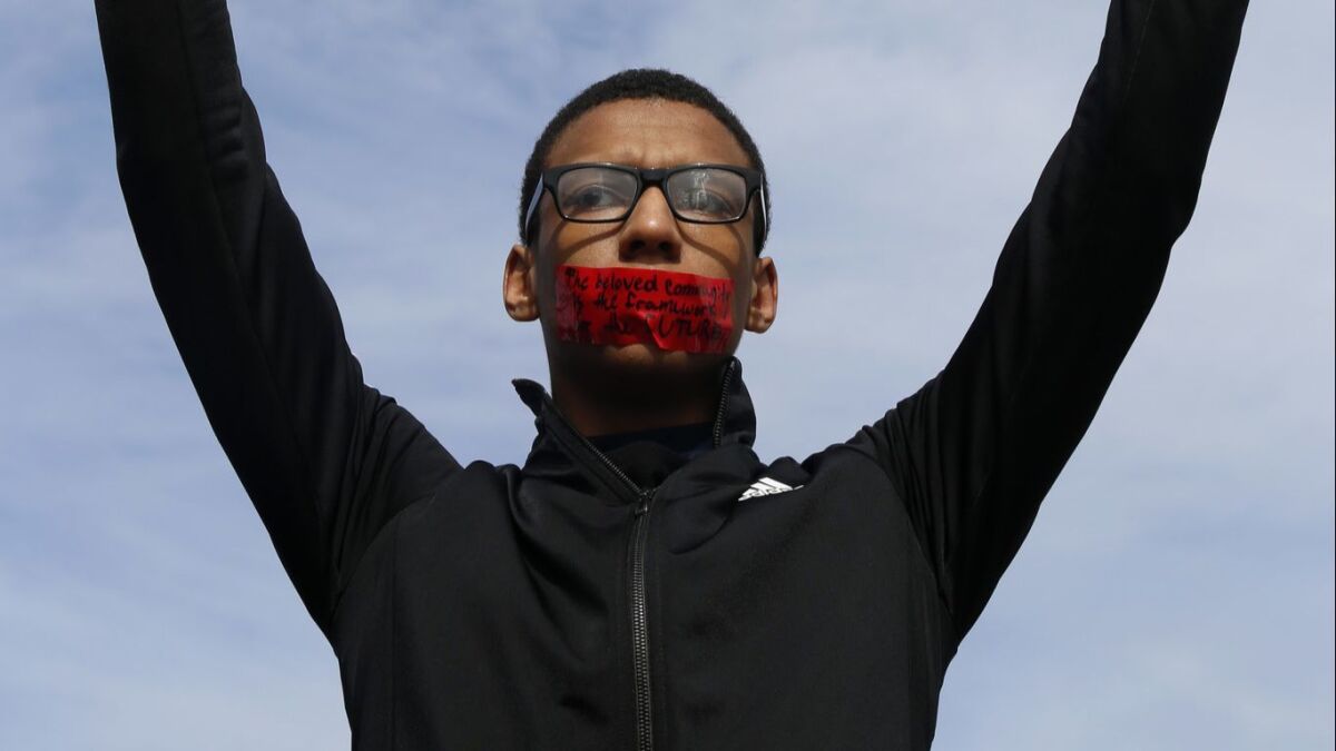 High school sophomore Kobey Lofton protests during an anti-violence march on March 14 in Chicago.