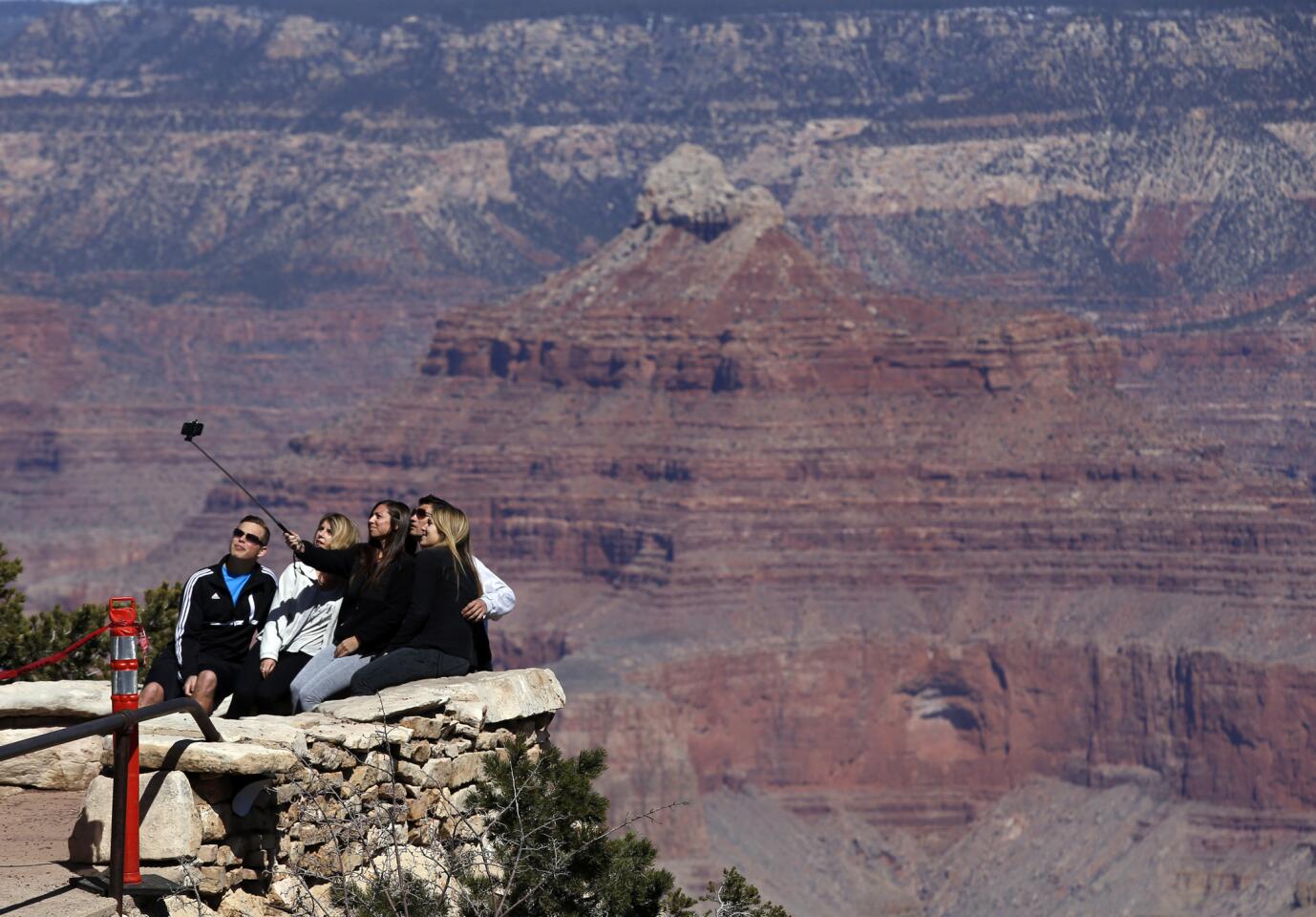 Selfie sticks are popular nowadays at the Grand Canyon as visitors capture pictures of themselves against the famous backdrop.