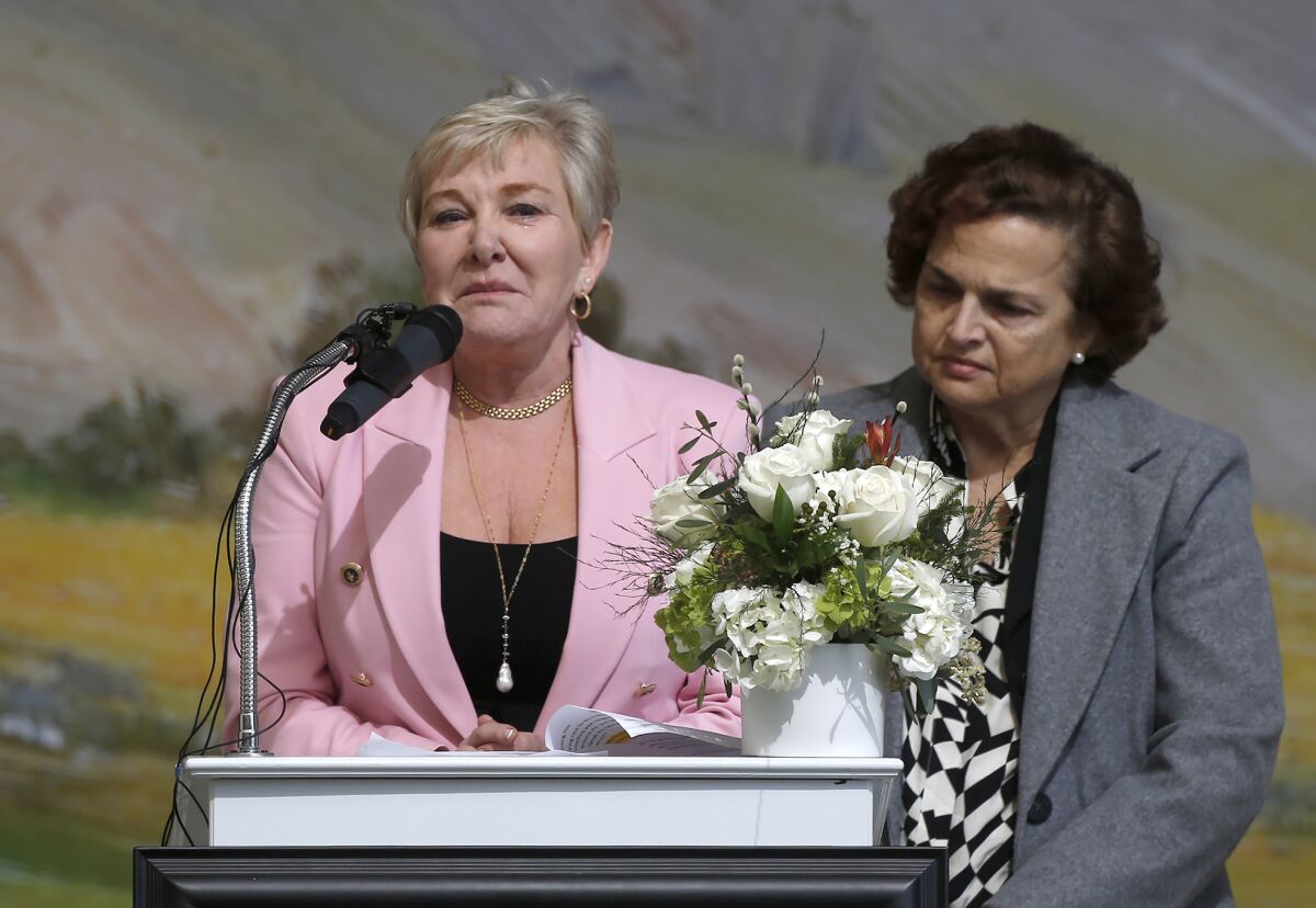 Julie Mammone, wife, reads a poem at the service.
