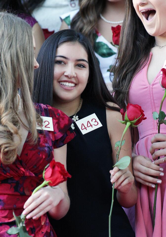 La Cañada High School's Sarah Sumiko Shaklan squeezes onto the stage after being selected to the Royal Court at the announcement of the 2016 Tournament of Roses Royal Court at the Tournament House in Pasadena on Monday, Oct. 5, 2015.