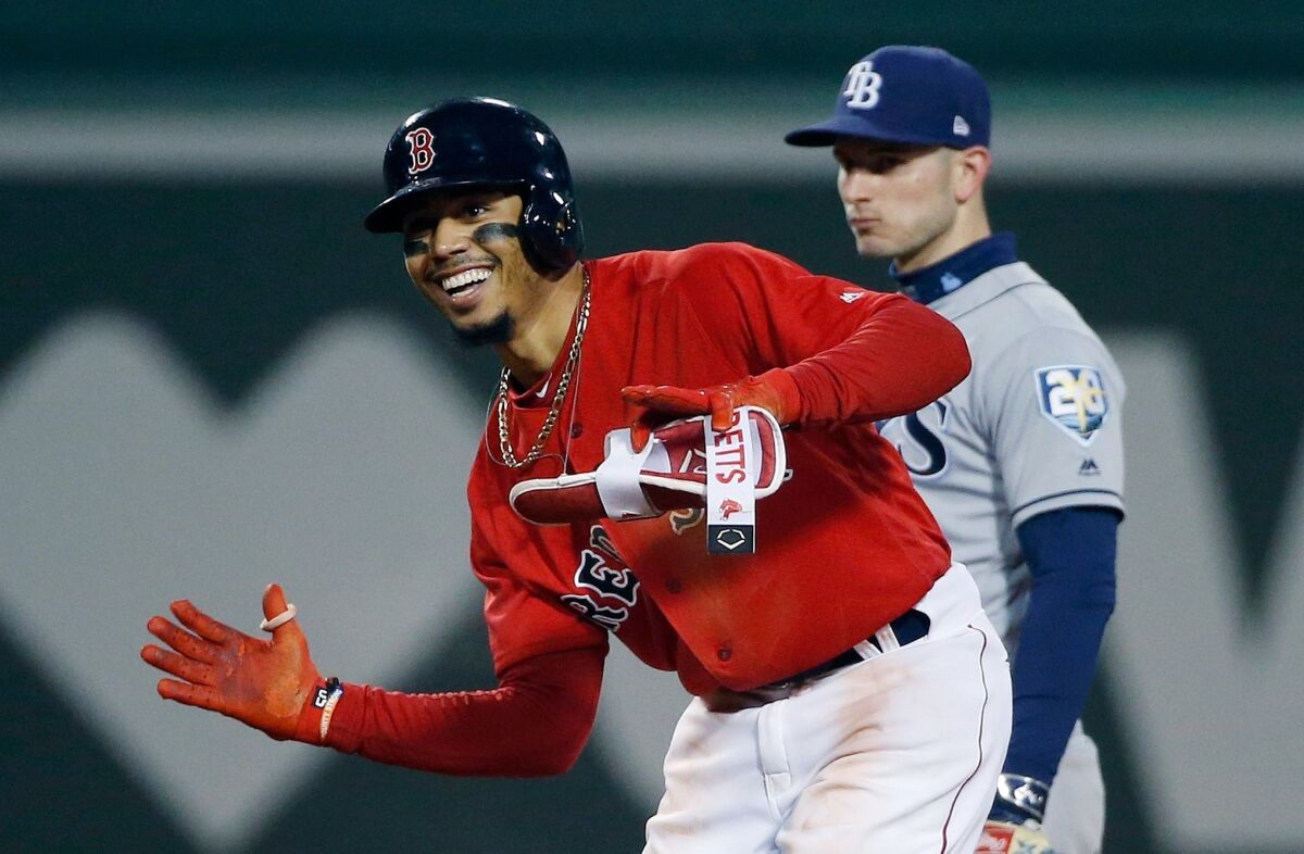 Mookie Betts celebrates a double against the Tampa Bay Rays in 2018.