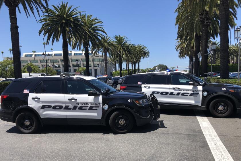 Several police vehicles from the Newport Beach Police Department blocked the entrances.