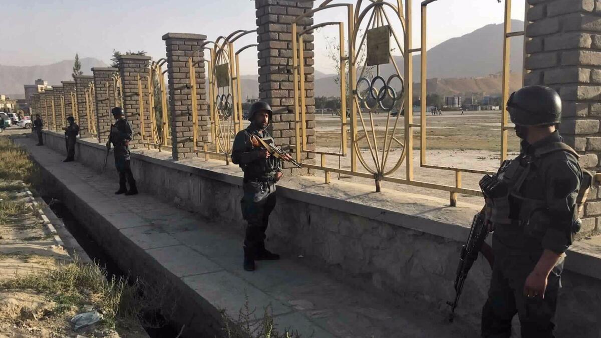 Afghan security police stand guard Sept. 13 near the site of a deadly suicide attack outside a cricket stadium, in Kabul, Afghanistan.