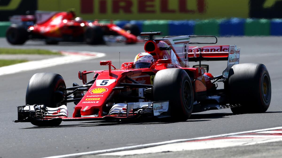 Sebastian Vettel wins third straight F1 world championship