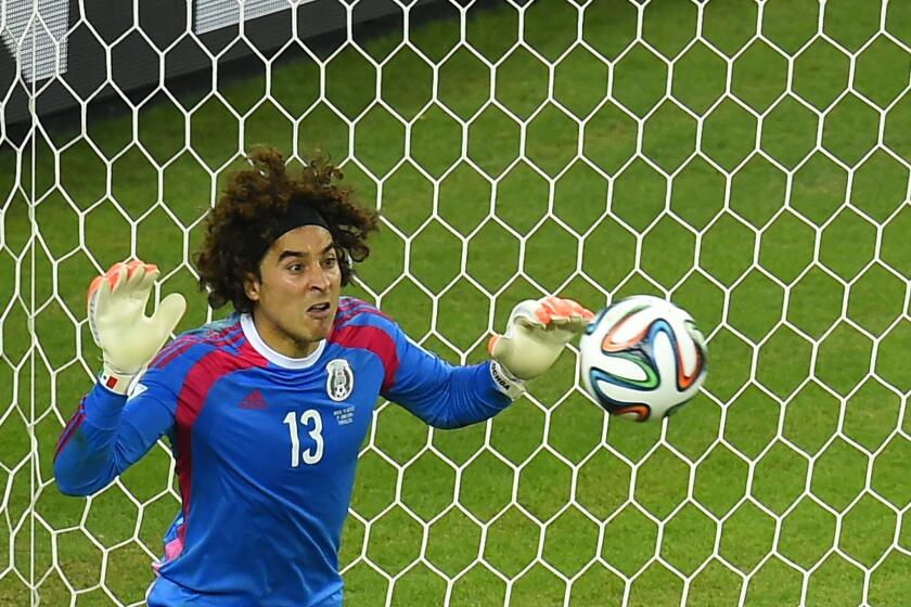 Mexico's goalkeeper Guillermo Ochoa saves an attempt at goal during a game against Brazil on Tuesday.