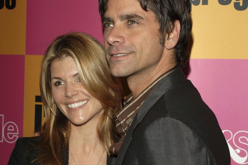 "Full House" stars Lori Loughlin and John Stamos, shown in 2006, said their romance "timing was off" while filming their sitcom.