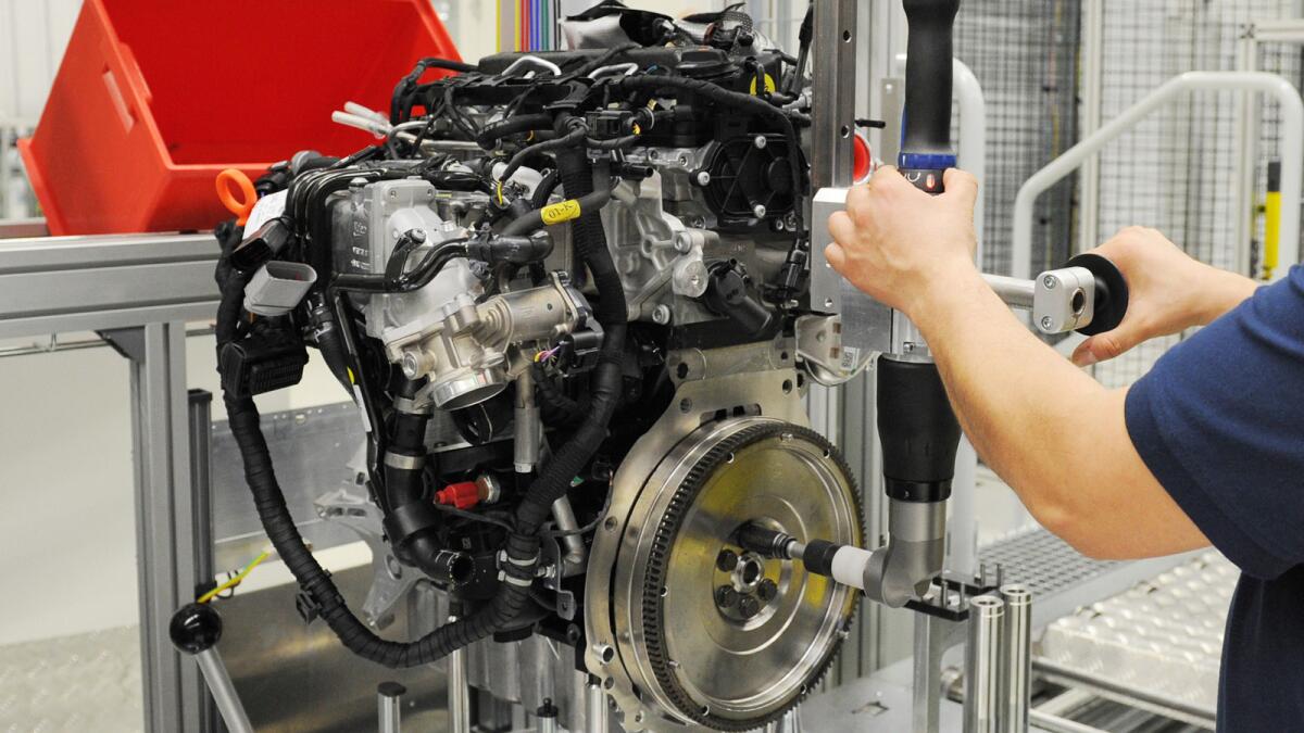 A worker with a diesel engine at a Volkswagen plant in Salzgitter, Germany.