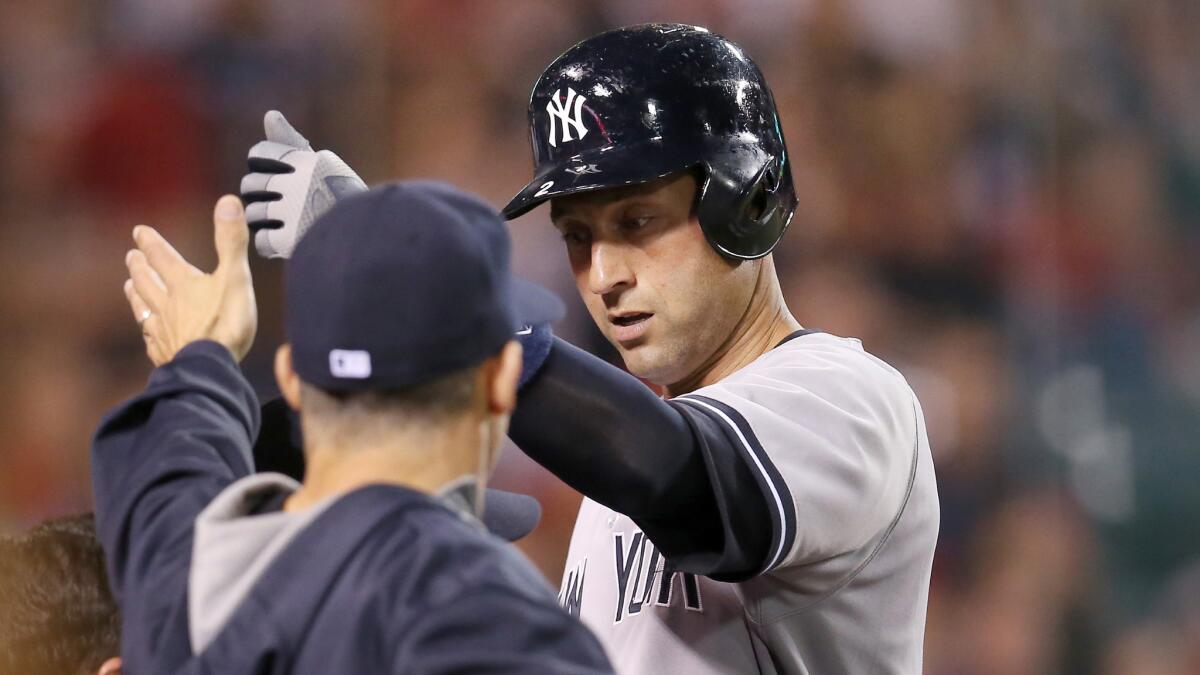 New York Yankees shortstop Derek Jeter is greeted by Manager Joe Girardi after hitting a double and scoring a run in Monday's 4-1 loss to the Angels. Can Jeter be a productive player for the Yankees in his final season with the team?