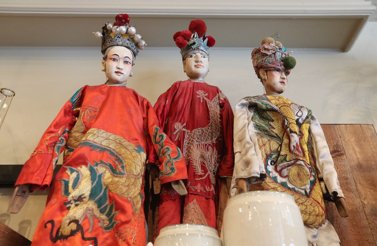 China dolls displayed for sale at the AREO store in downtown Laguna Beach on December 29.