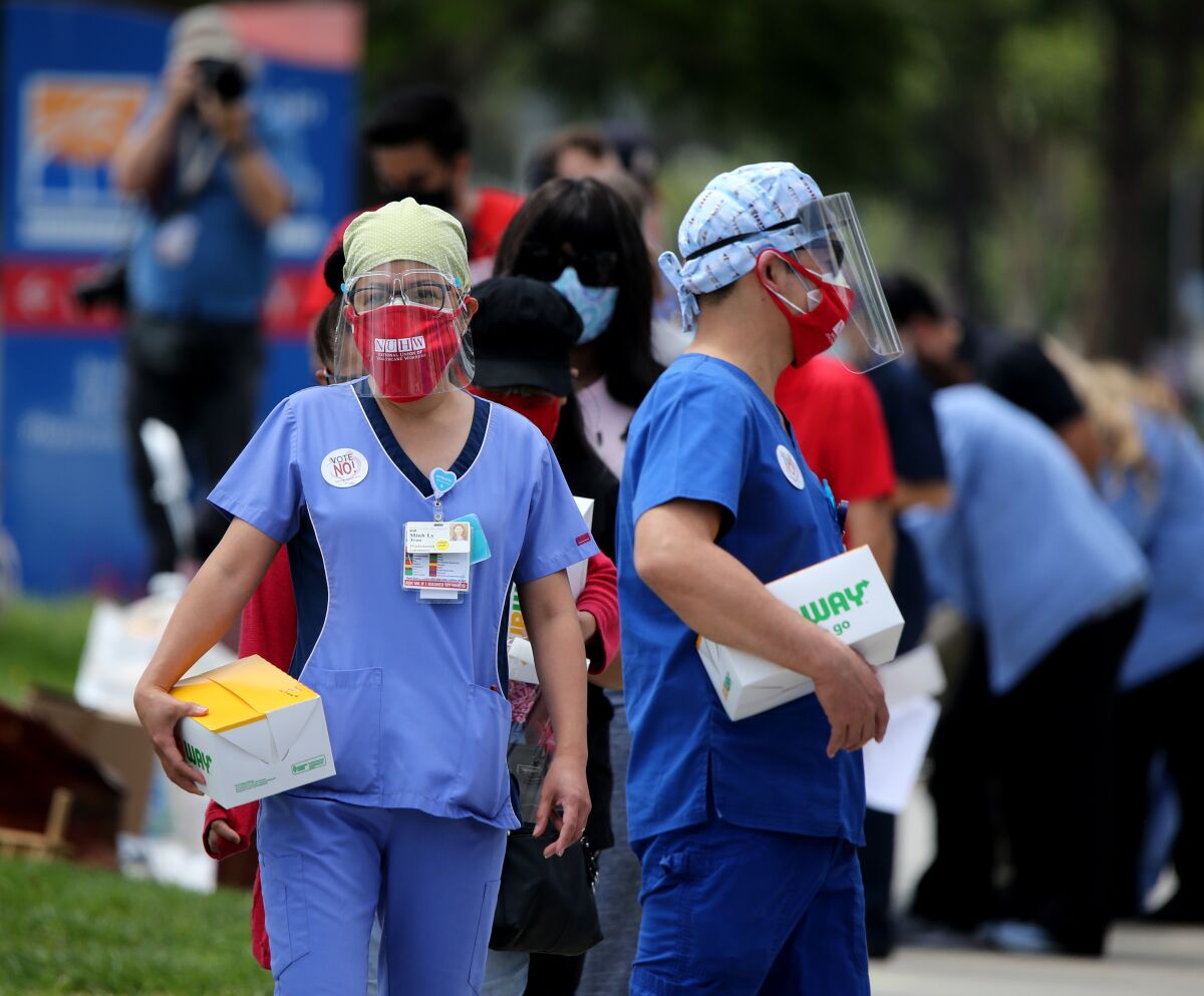 Protesters march outside Fountain Valley Regional Hospital and Medical Center in Fountain Valley in 2020.