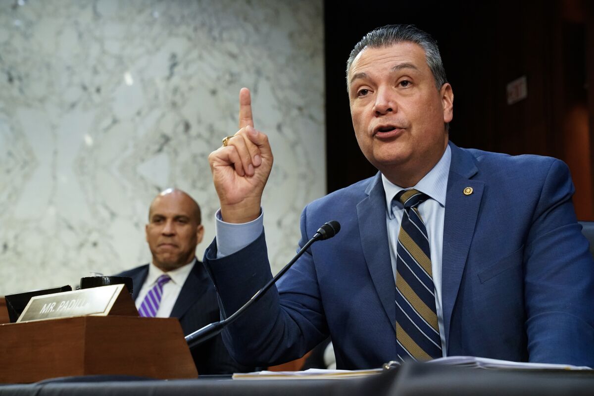 Sen. Alex Padilla speaks at a hearing, with Sen. Cory Booker in background