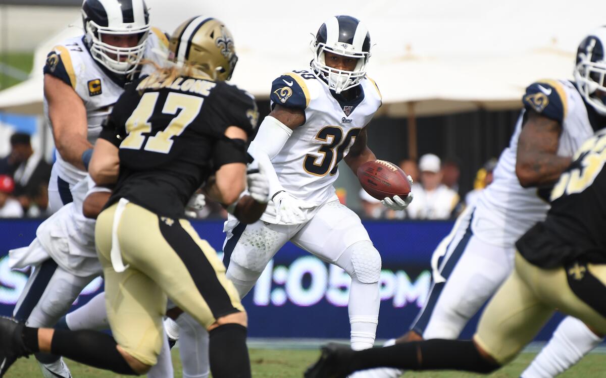 Rams runing back Todd Gurley looks for an opening while running the ball during Sunday's 27-9 victory over the Saints.