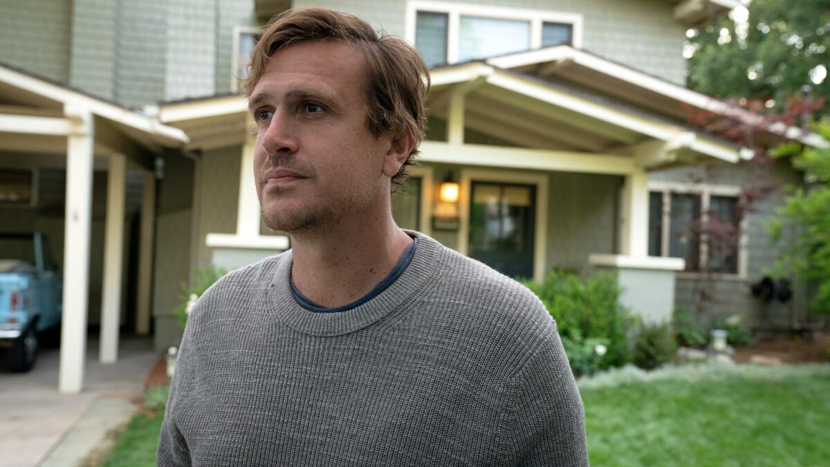 A man standing outside his Pasadena home