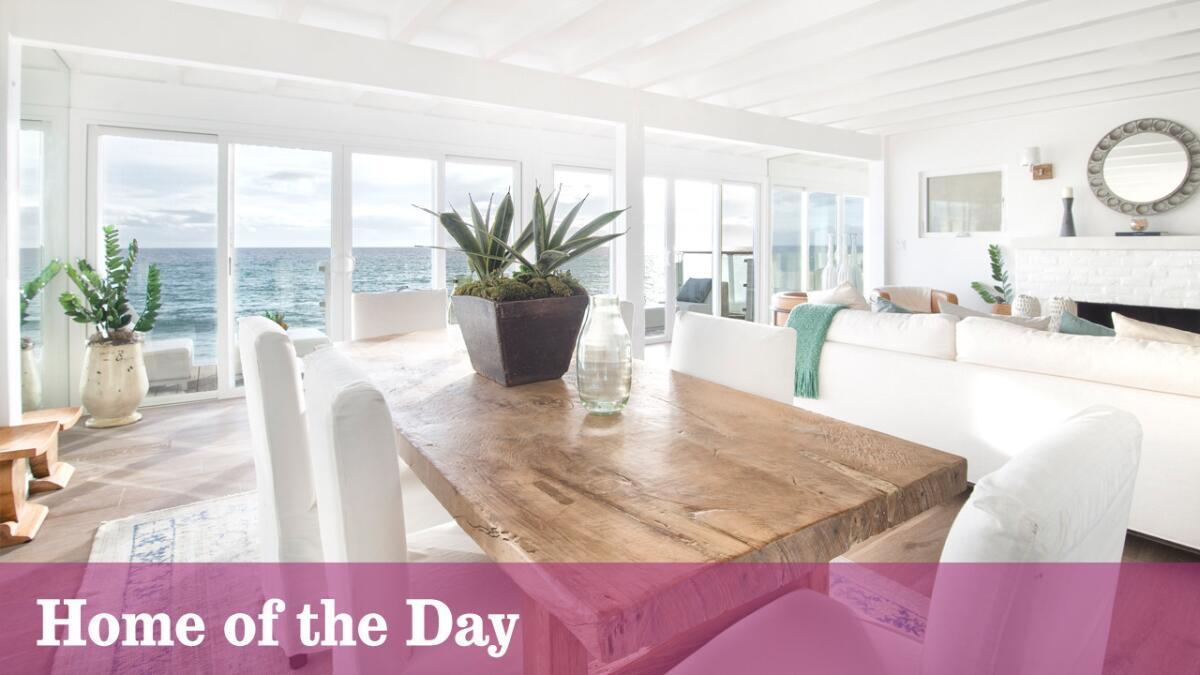 The oceanfront home in Malibu has three bedrooms and 2.5 bathrooms in nearly 2,200 square feet of white-walled space.