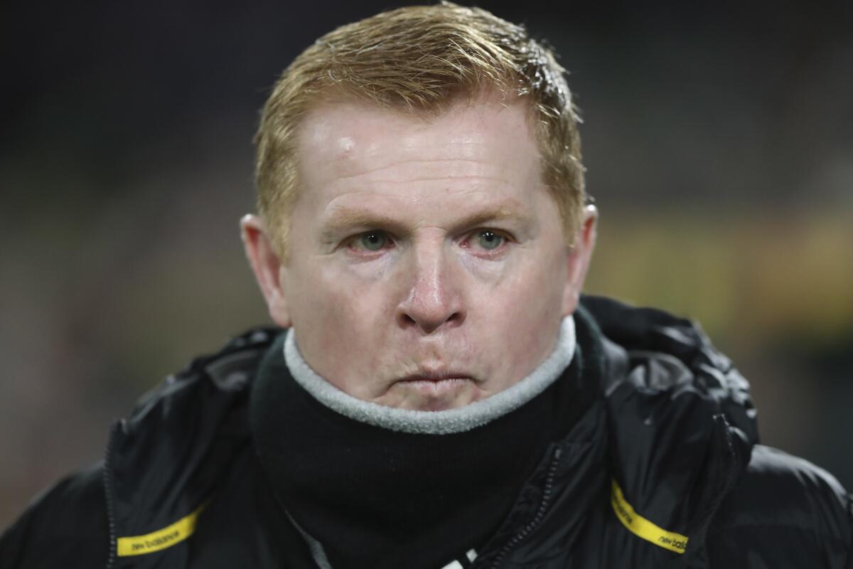 FILE - In this Thursday, Feb. 27, 2020 file photo, Celtic manager Neil Lennon looks on prior to the Europa League round of 32, second leg soccer match between Celtic and FC Copenhagen at the Celtic Park stadium in Glasgow, Scotland. Scottish giant Celtic is in crisis and its manager is fighting for his job. The Glasgow team has had an unprecedented run of sustained success in recent years but is out of European competition already and 11 points behind great rival Rangers in a faltering bid for a record 10th straight Scottish Premiership title. (AP Photo/Scott Heppell, File)