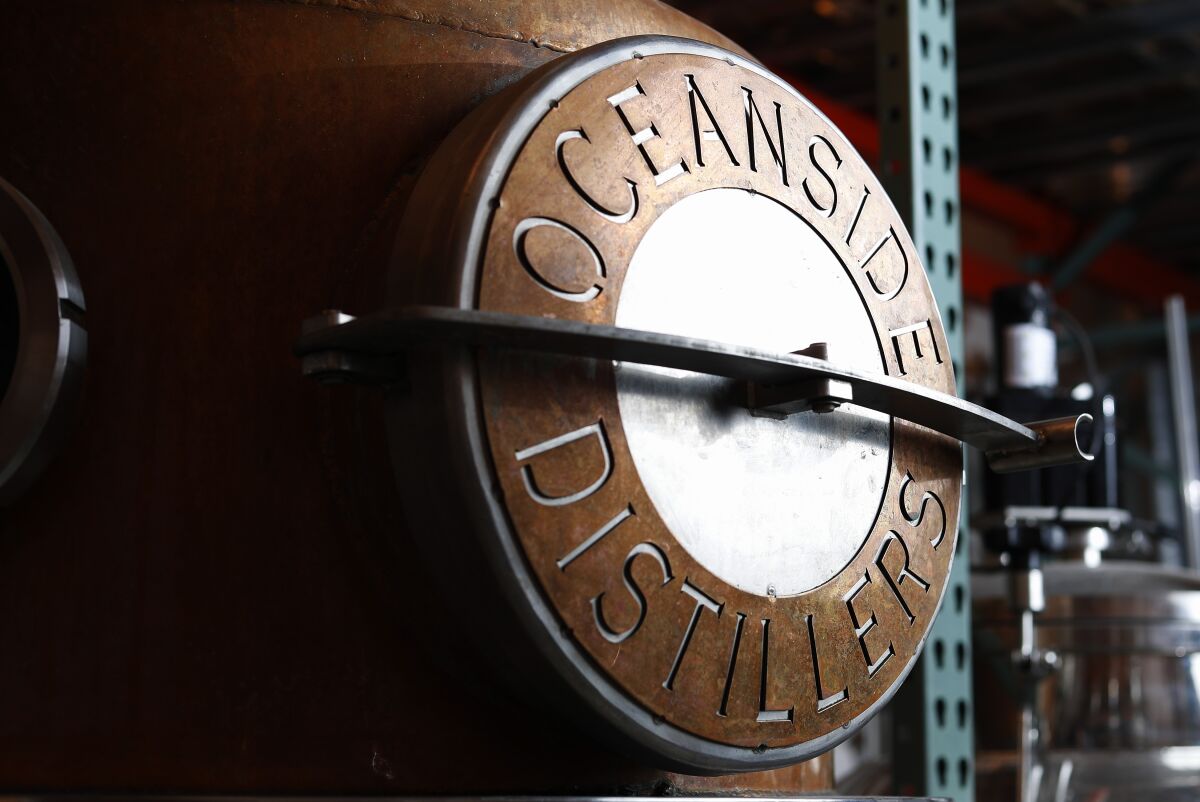 A piece of distillery machinery with "Oceanside Distillers" written on it