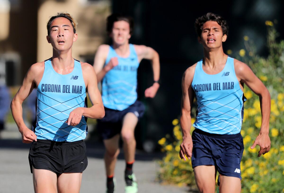 Corona del Mar's Colin Choe, left, leads his team's runners.