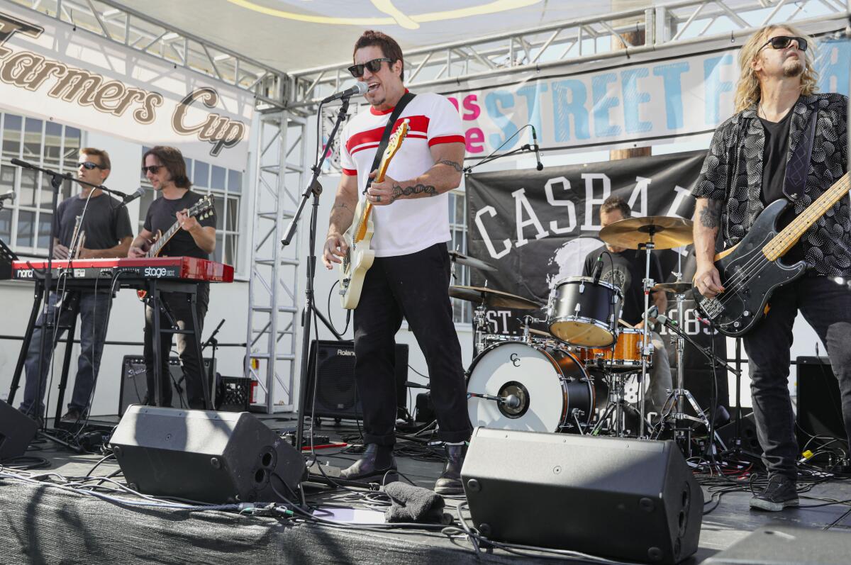 Members of local San Diego band Minaturized perform during the Adams Avenue Street Fair.