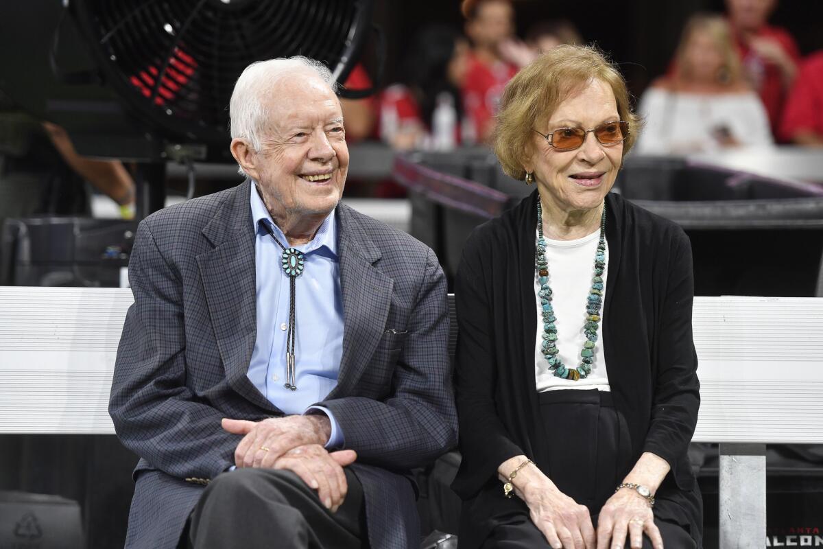 President Carter and his wife, Rosalynn Carter, at a football game in Atlanta in 2018