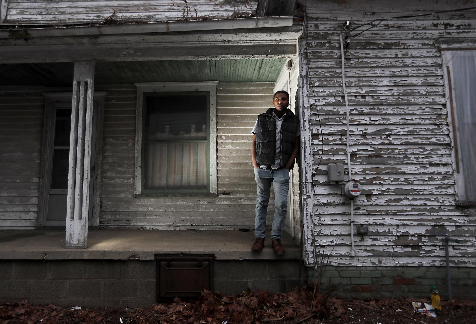 Jorden Giger, 28, a teacher and Black Lives Matter activist, outside a vacant house in the Near Northwest Neighborhood of South Bend, Ind.