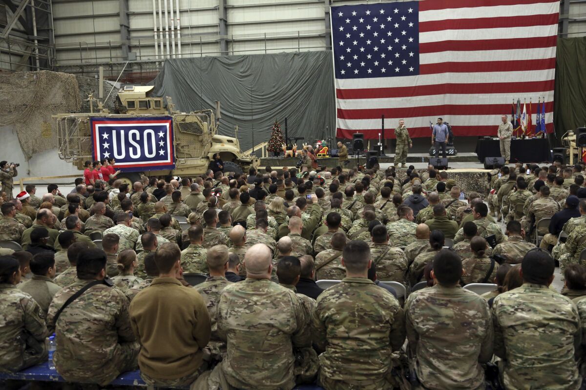 U.S. troops attend a ceremony on Christmas Eve