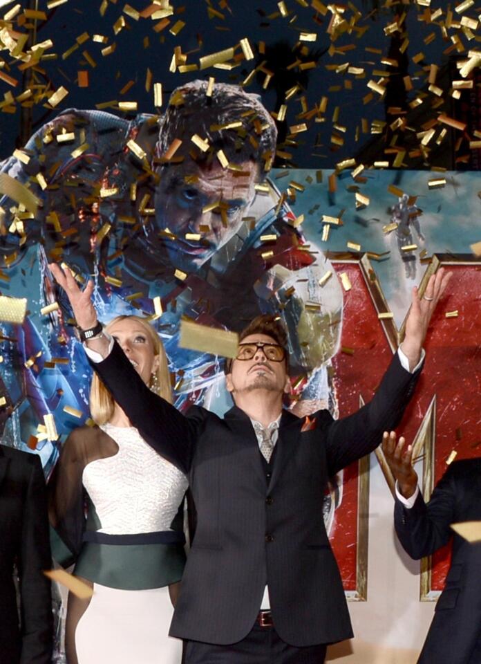 Robert Downey Jr. makes an entrance at the premiere of "Iron Man 3" at Hollywood's El Capitan Theatre.