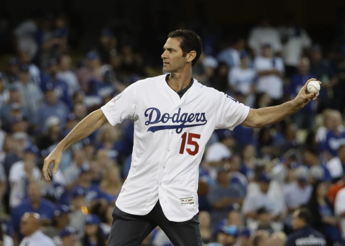 Shawn Green throws the first pitch before Game 4 of the 2018 NLCS.
