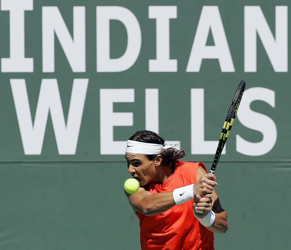 Rafael Nadal hits a return during a match at Indian Wells in March 2006.