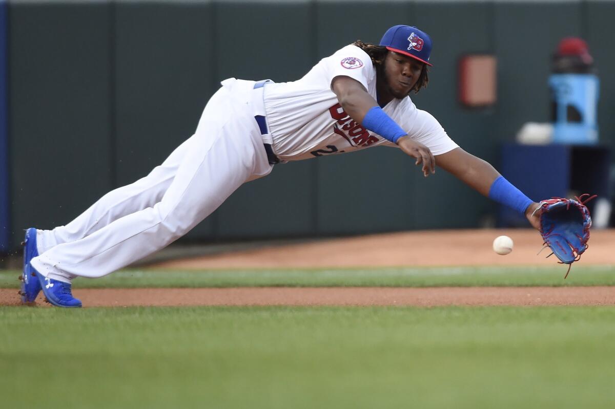 Vladimir Guerrero Jr. dives for a ground ball during a game for the Buffalo Bisons last summer.
