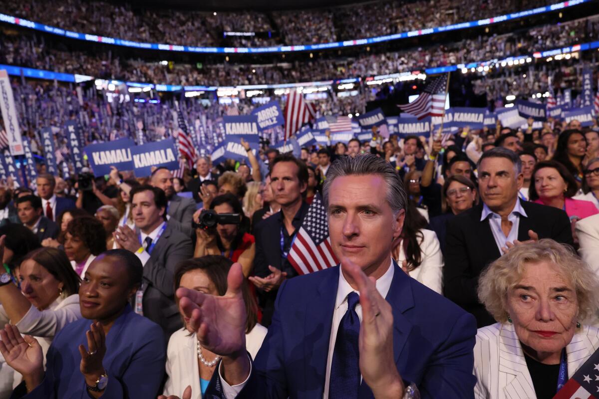 California Gov. Gavin Newsom applauds during the Democratic National Convention in Chicago