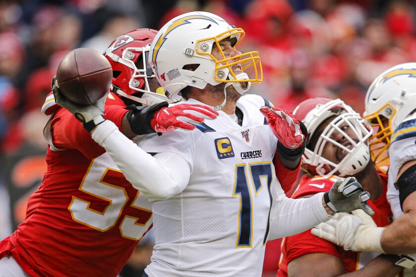 KANSAS CITY, MO - DECEMBER 29: Frank Clark #55 of the Kansas City Chiefs pressures Philip Rivers #17 of the Los Angeles Chargers on a third quarter pass at Arrowhead Stadium on December 29, 2019 in Kansas City, Missouri. (Photo by David Eulitt/Getty Images)