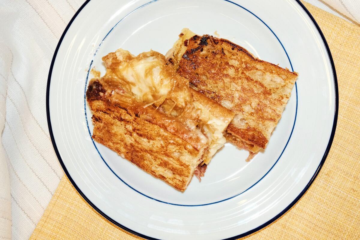 Pasjoli chef-owner Dave Beran prepares his restaurant's croque Matthieu, or grilled cheese sandwich.