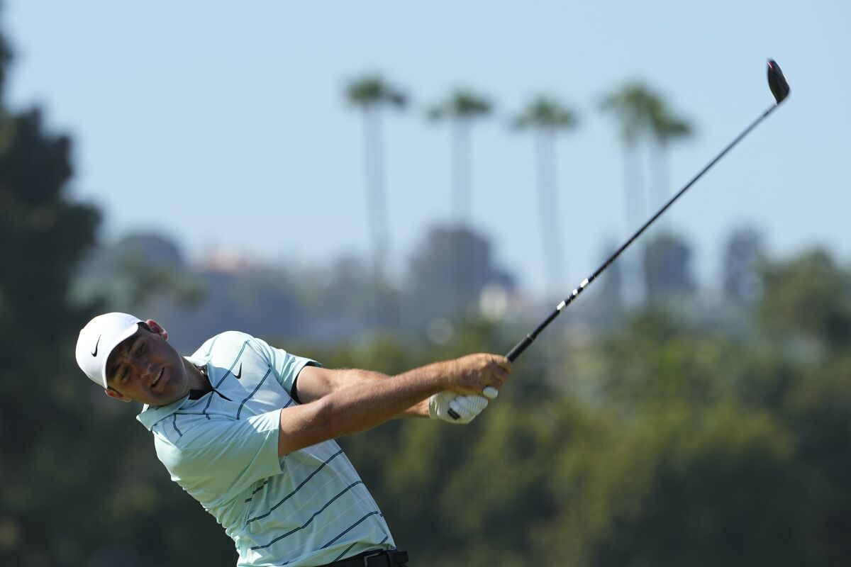 Scottie Scheffler hits from the eighth tee during the third round of the U.S. Open on Saturday.