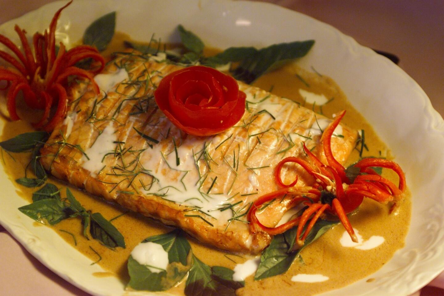 Salmon in red curry sauce.