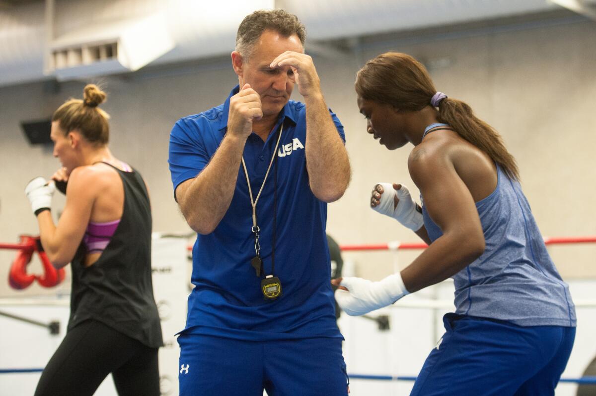 American middleweight Claressa Shields, a gold medalist at the 2012 London Olympics, trains with U.S. boxing team coach Billy Walsh, left, at the U.S. Olympic Training Center in Colorado Springs, Colo., on July 15.