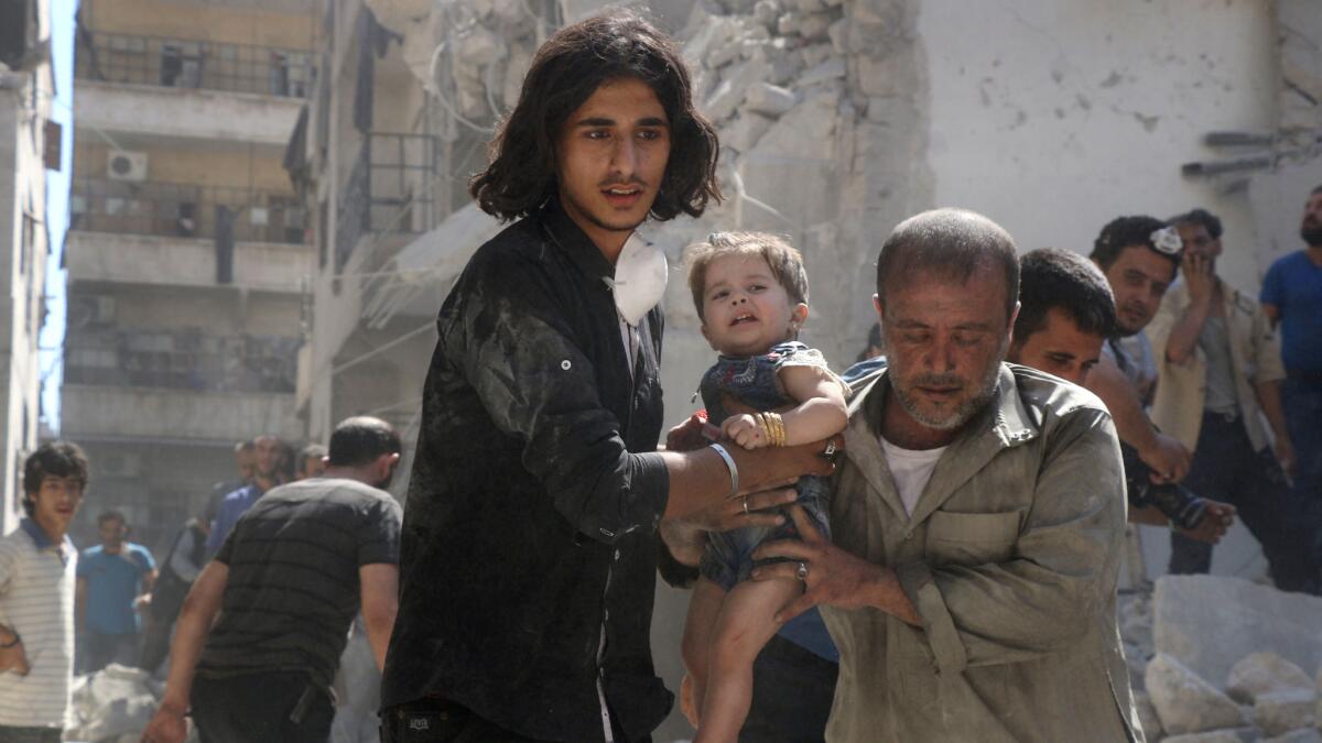 A little girl is rescued from the rubble after a reported airstrike in a rebel-held part of Aleppo, Syria, on Sept. 10, 2016. The U.S. and Russia reached agreement on an initiative to halt the warfare in Syria.