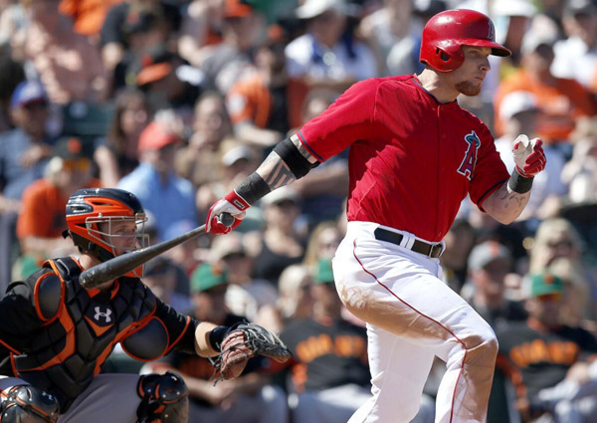Angels outfielder Josh Hamilton, connects for a single against the Giants in the fourth inning of an exhibition game on Monday.