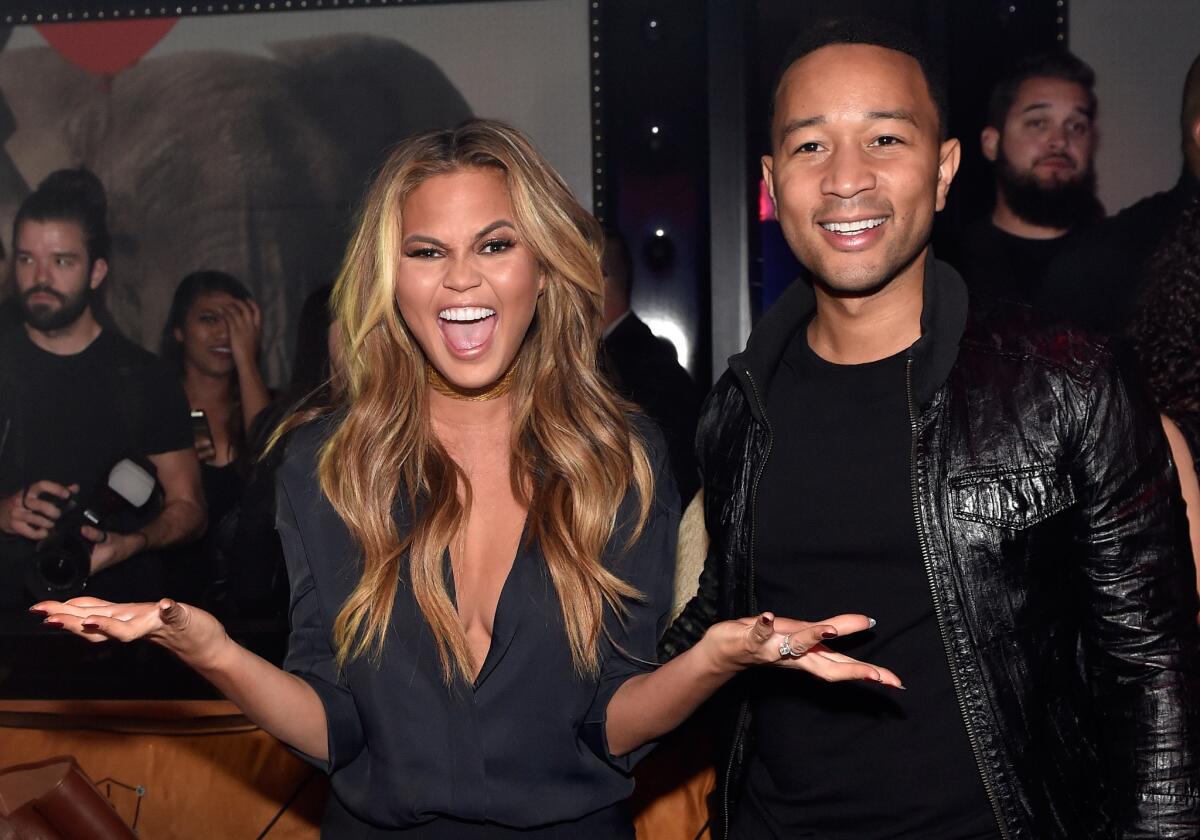 Model Chrissy Teigen and singer John Legend host at 1 OAK Nightclub at the Mirage during a special pre-Billboard Music Awards party.