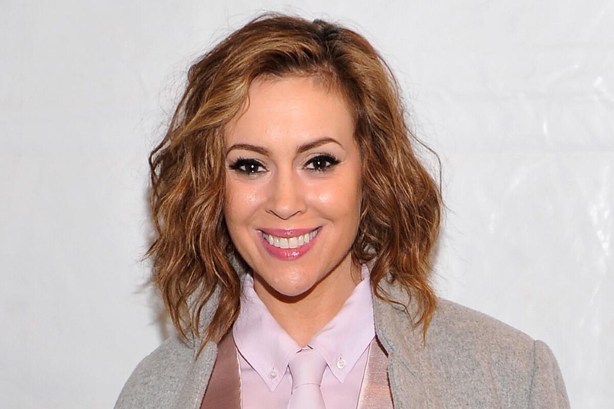 Alyssa Milano, seen in February backstage at the Marissa Webb fashion show during Mercedes-Benz Fashion Week in New York, announced Friday that she's pregnant again.