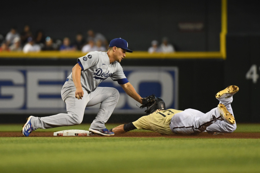 The Diamondbacks' Nick Ahmed steals second base ahead of Dodgers shortstop Corey Seager's tag during the fourth inning.