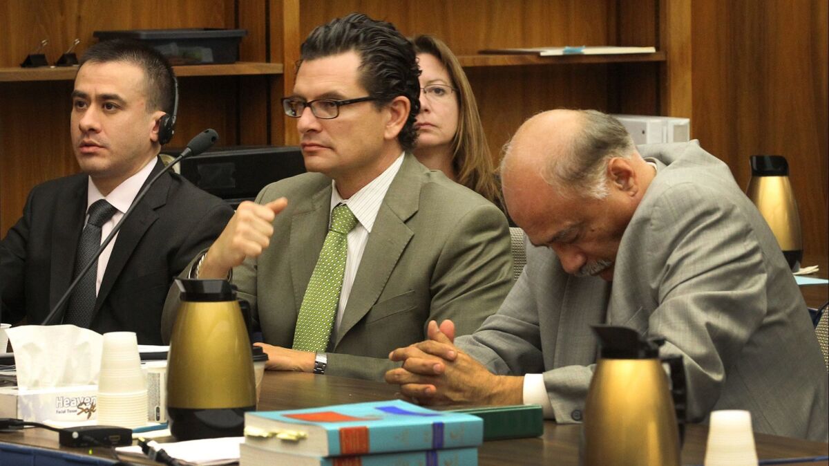 Jorge Rojas Lopez and his defense attorneys Dan Mangarin, right, and Ricardo Garcia center, listened as judge David Rubin read the verdicts against Rojas on Thursday, January 16, 2014.