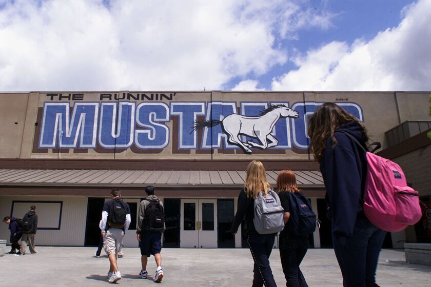 Don Tormey x65652 –– – Mission Viejo––Students return to class from lunch by the school logo at Trabuco Hills High School in Mission viejo recognized today as a California Distinguished School for the first time.